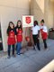 Young volunteers ring the kettle bells with Major CeCe LaLanne.jpg